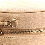 Iridescent Caviar Quilted Round Clutch With Chain Beige