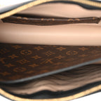 Reverse Monogram Trunk Clutch
